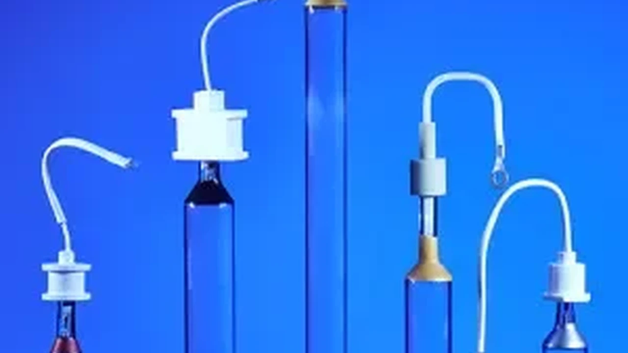 Close up on a plate of mashed potatoes, topped with baked pork chops with cream of mushroom soup, and a side of green beans.