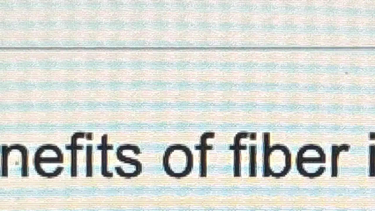 Close up on a plate of mashed potatoes, topped with baked pork chops with cream of mushroom soup, and a side of green beans.