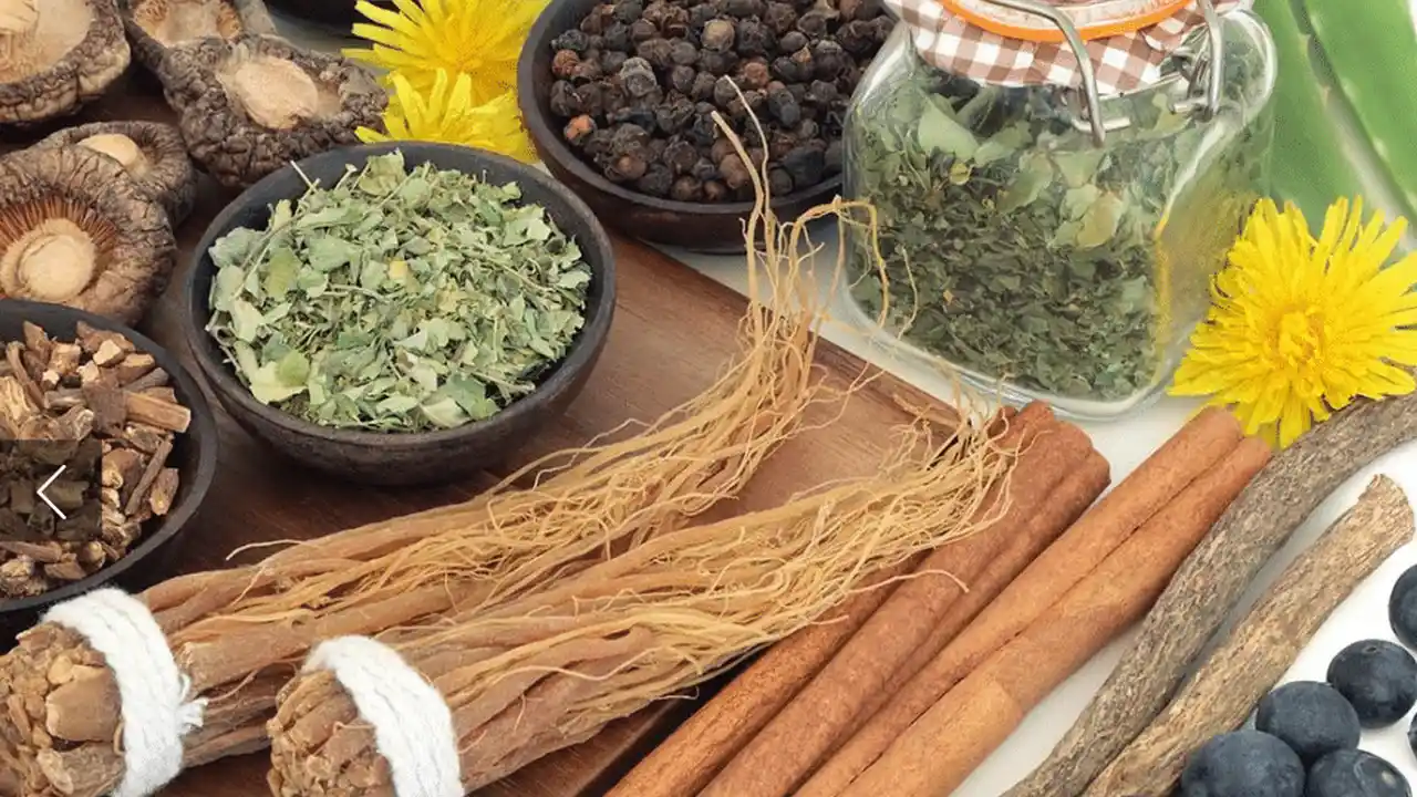 overhead view of corned beef sliced and on a platter with cabbage, potatoes, and carrots