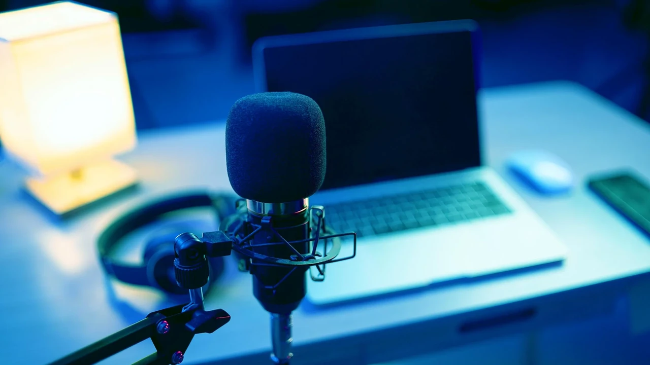 Close up on a plate of mashed potatoes, topped with baked pork chops with cream of mushroom soup, and a side of green beans.